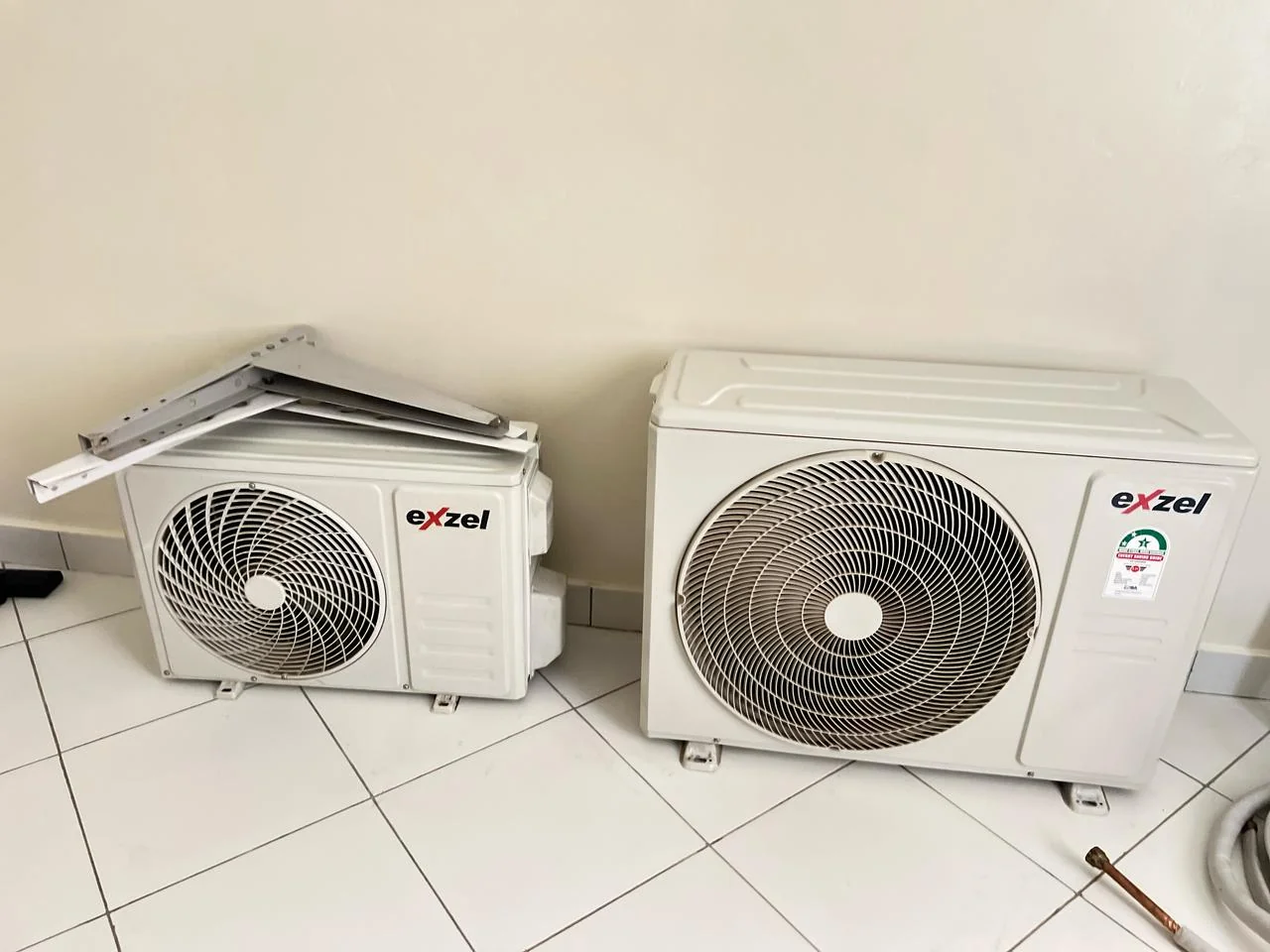 Close-up of technician working on outdoor AC condensing unit